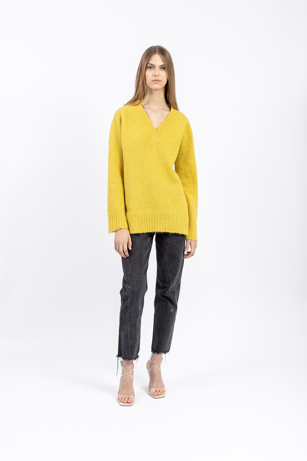 Alpaca wool blend pullover in soft yellow, V-neck, worn by model