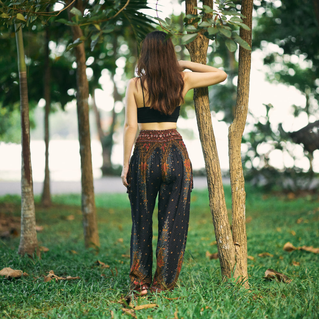 Black peacock print harem pants for festivals and yoga