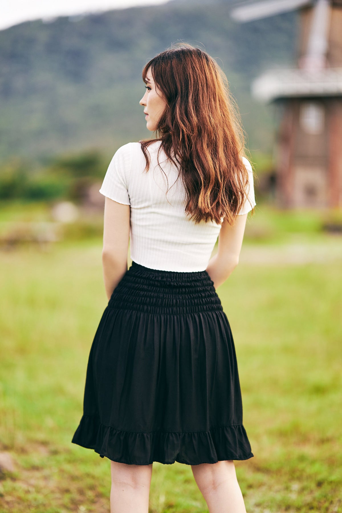 Women's black skater skirt in mini length with high waist detail