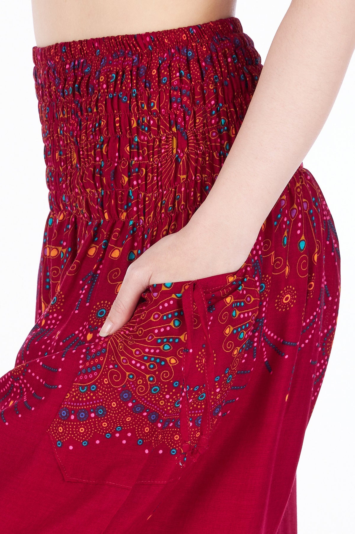 Burgundy printed harem pants with decorative string pockets