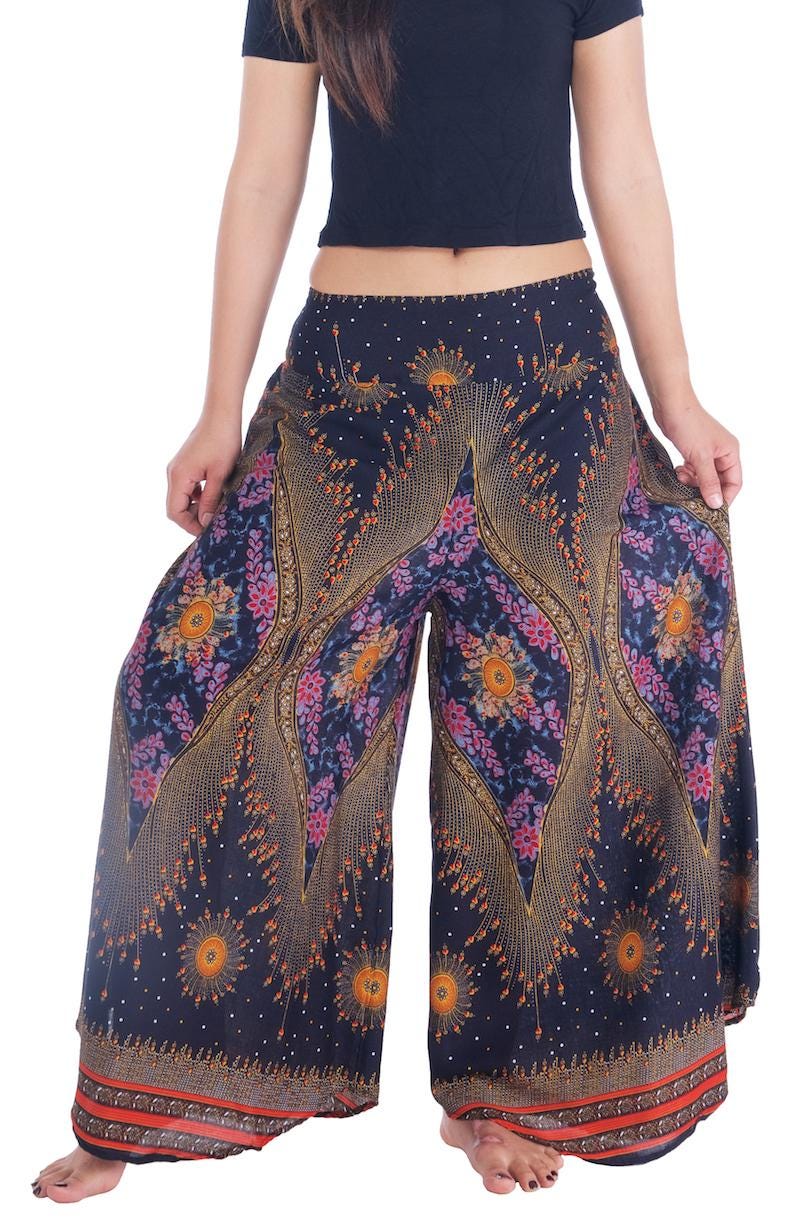 Teal palazzo pants styled for summer beach fashion, flowy wide leg