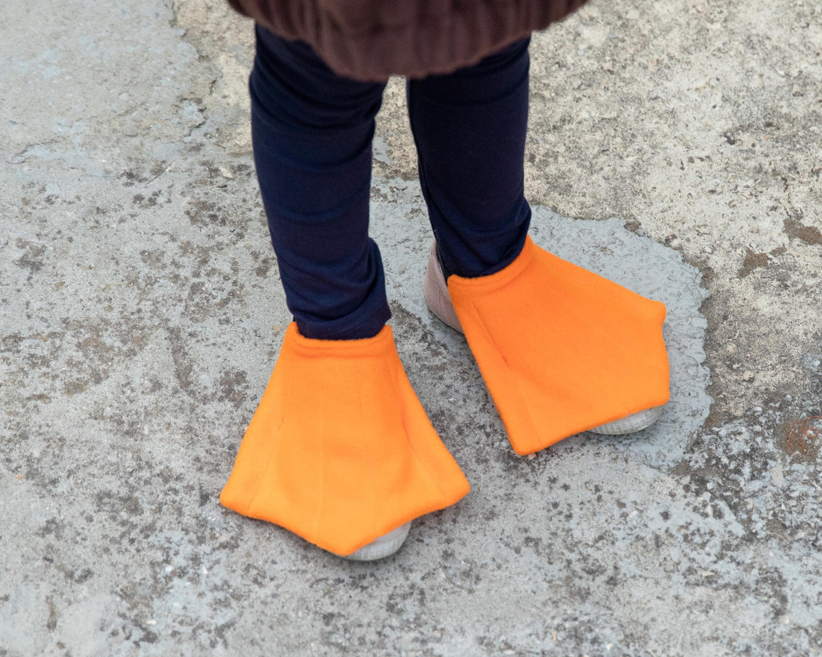 Orange duck feet shoe covers paired with duck costume for Halloween