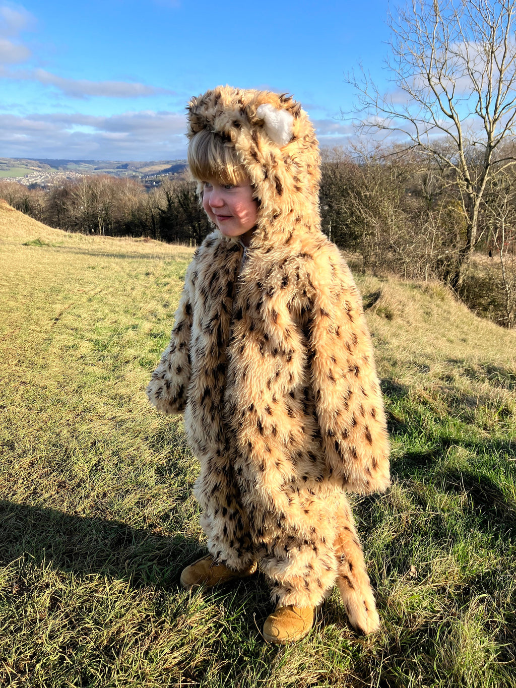 Child wearing handmade faux fur cheetah onesie costume with front zip