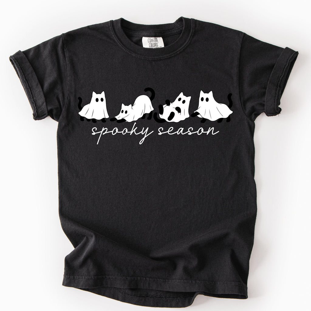 Spooky season shirt with playful pumpkin chasing ghost artwork
