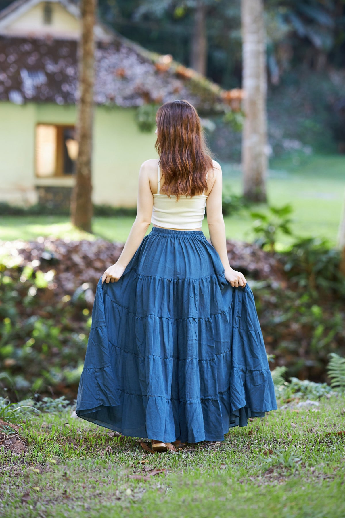 Plus size wedding guest outfit dark gray maxi skirt with tiered ruffle design