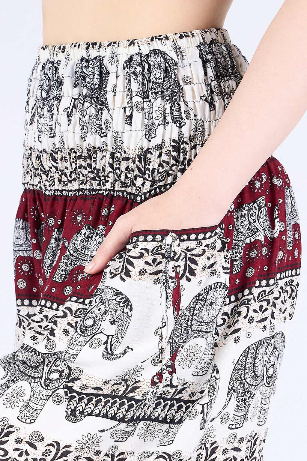Close-up of ivory burgundy elephant harem pants showing soft rayon texture and pockets
