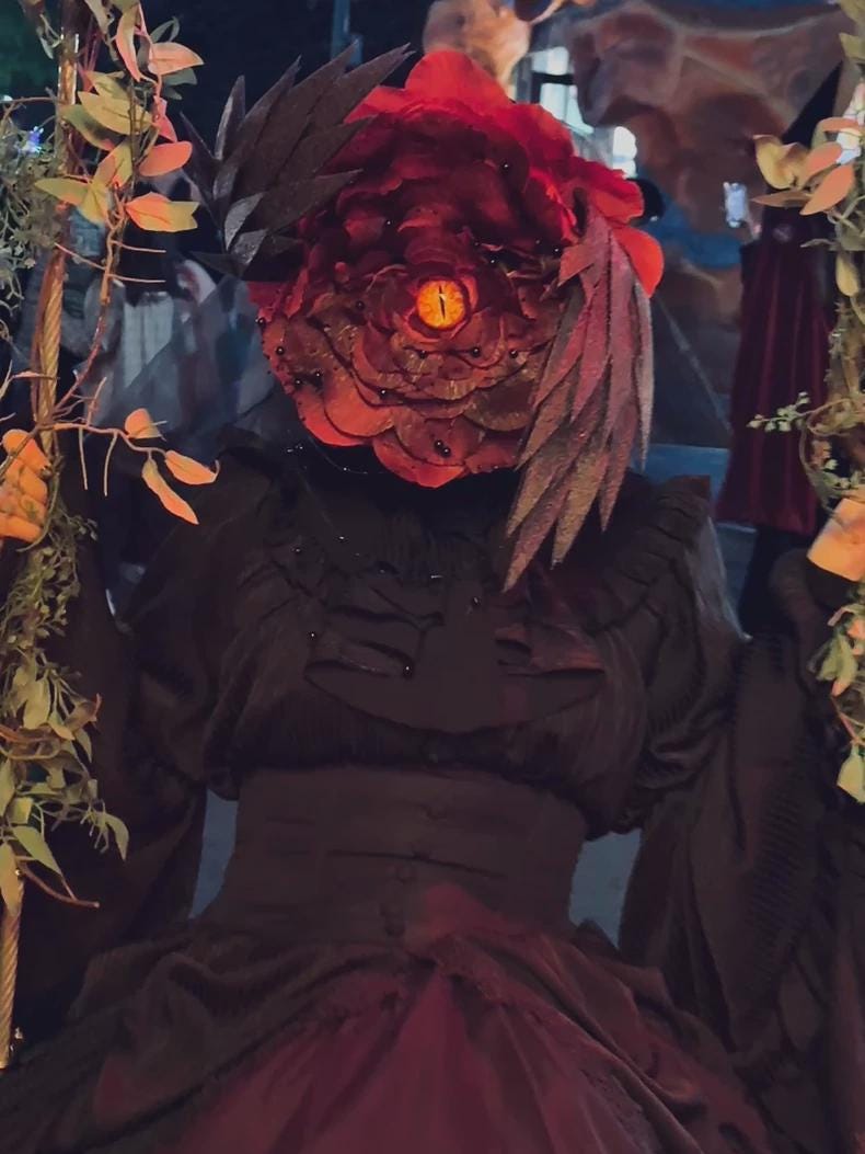 Dark romantic flower creature mask for alternative fashion styling