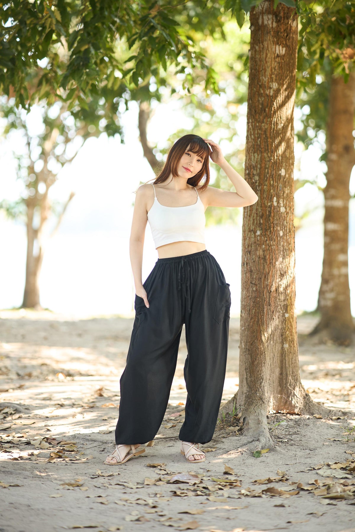 Black harem sweatpants for women with drawstring waist and side pockets