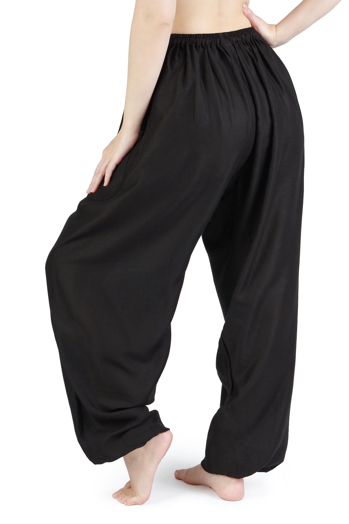 Comfy black harem sweatpants for travel and beachwear
