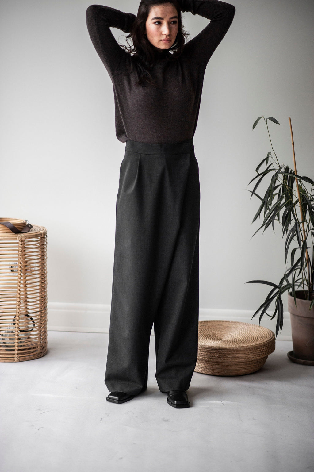Model wearing high waist wide leg wool trousers size S
