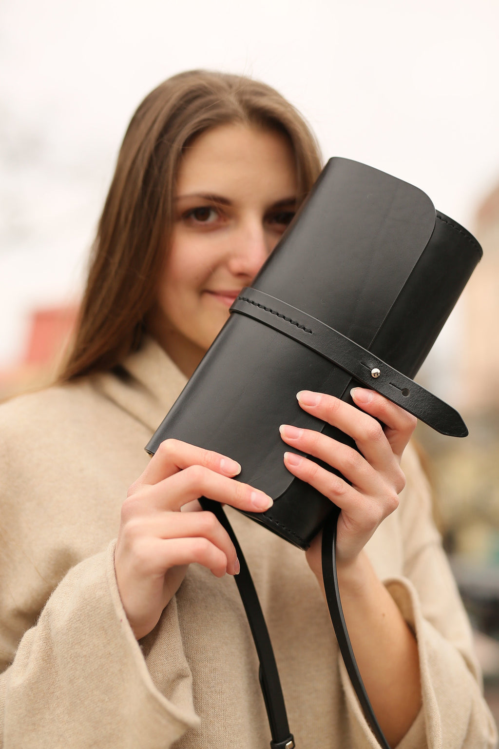 Compact black leather shoulder bag with two compartments