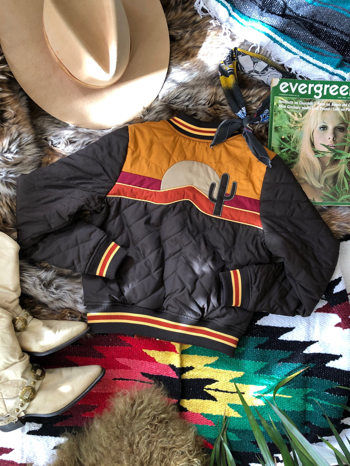 Sonoran Sunrise bomber jacket lying flat showing measurements for XS to 3X sizing