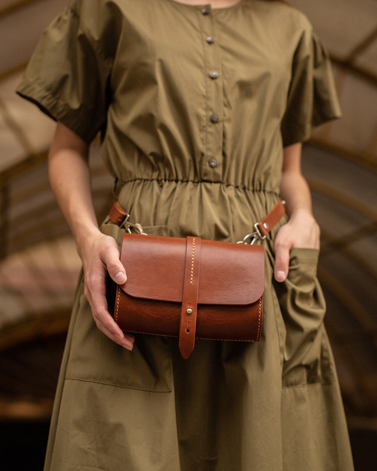 Women's convertible Italian leather belt bag worn as a minimalist waist fanny pack