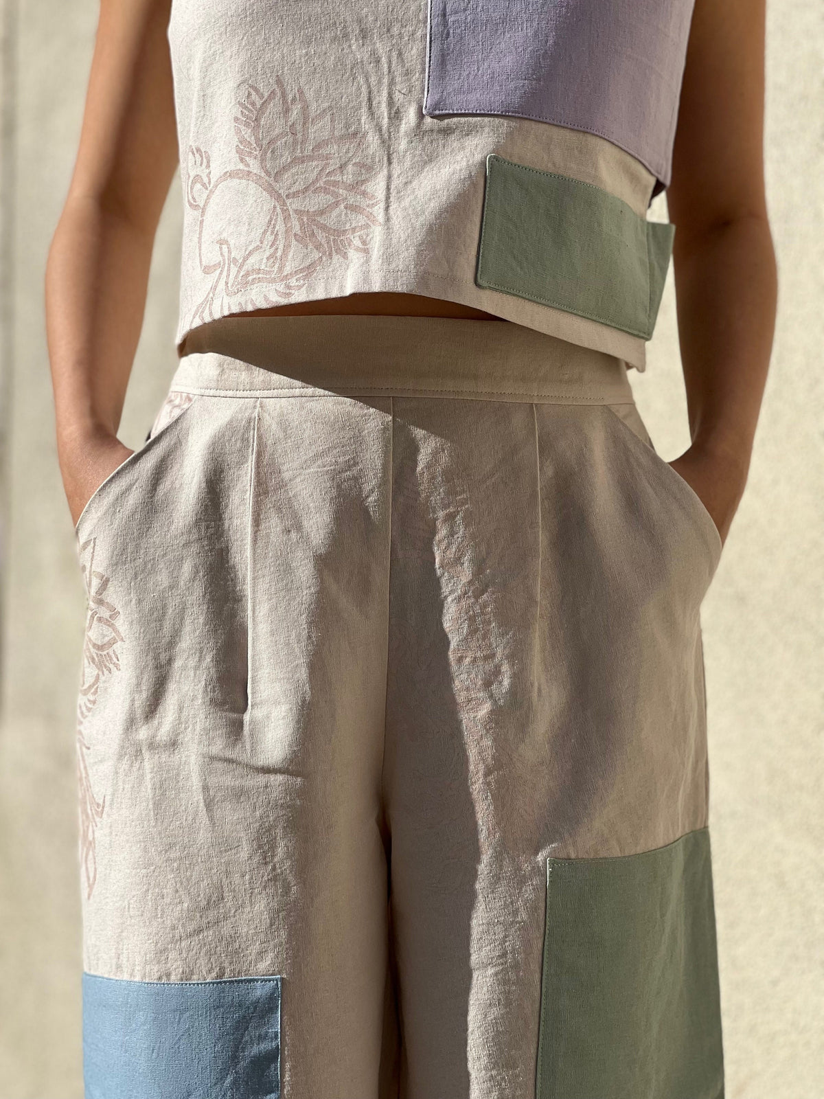 Close-up of hand-painted textile print on linen blend wide-leg pants