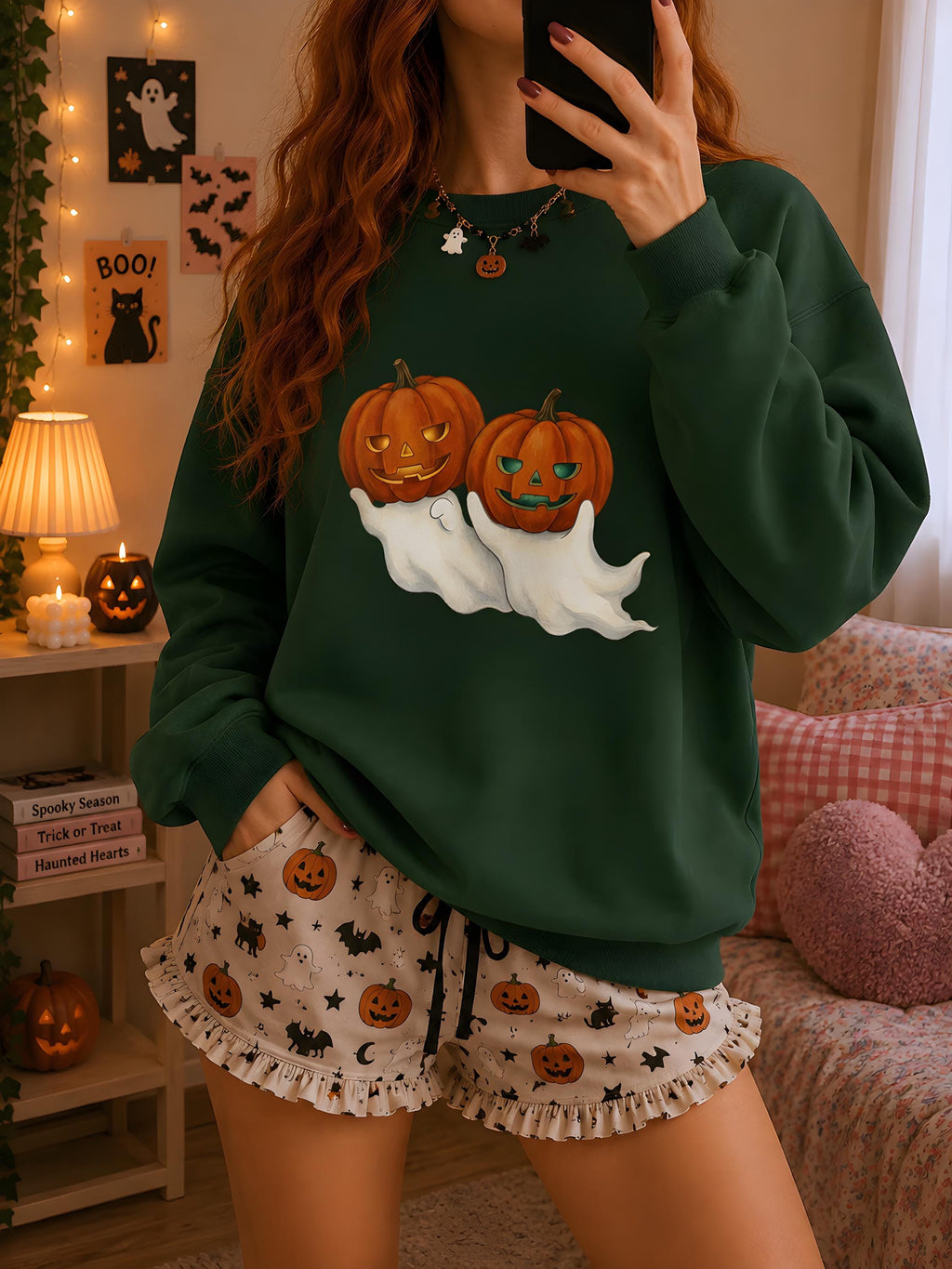 Unisex Halloween sweatshirt with ghost and jack-o'-lantern graphic on chest