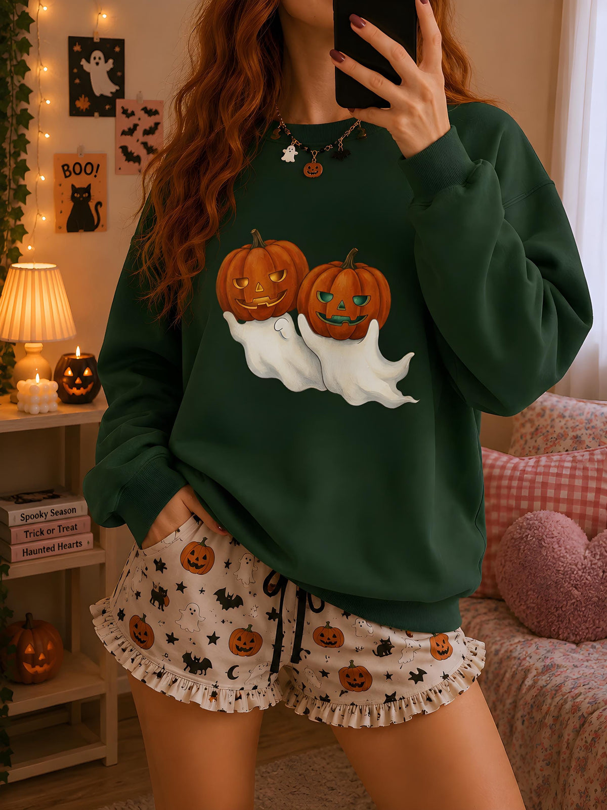Unisex Halloween sweatshirt with ghost and jack-o'-lantern graphic on chest