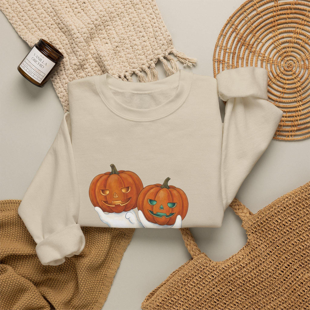 Unisex heavy blend sweatshirt featuring ghost and jack-o'-lantern graphic