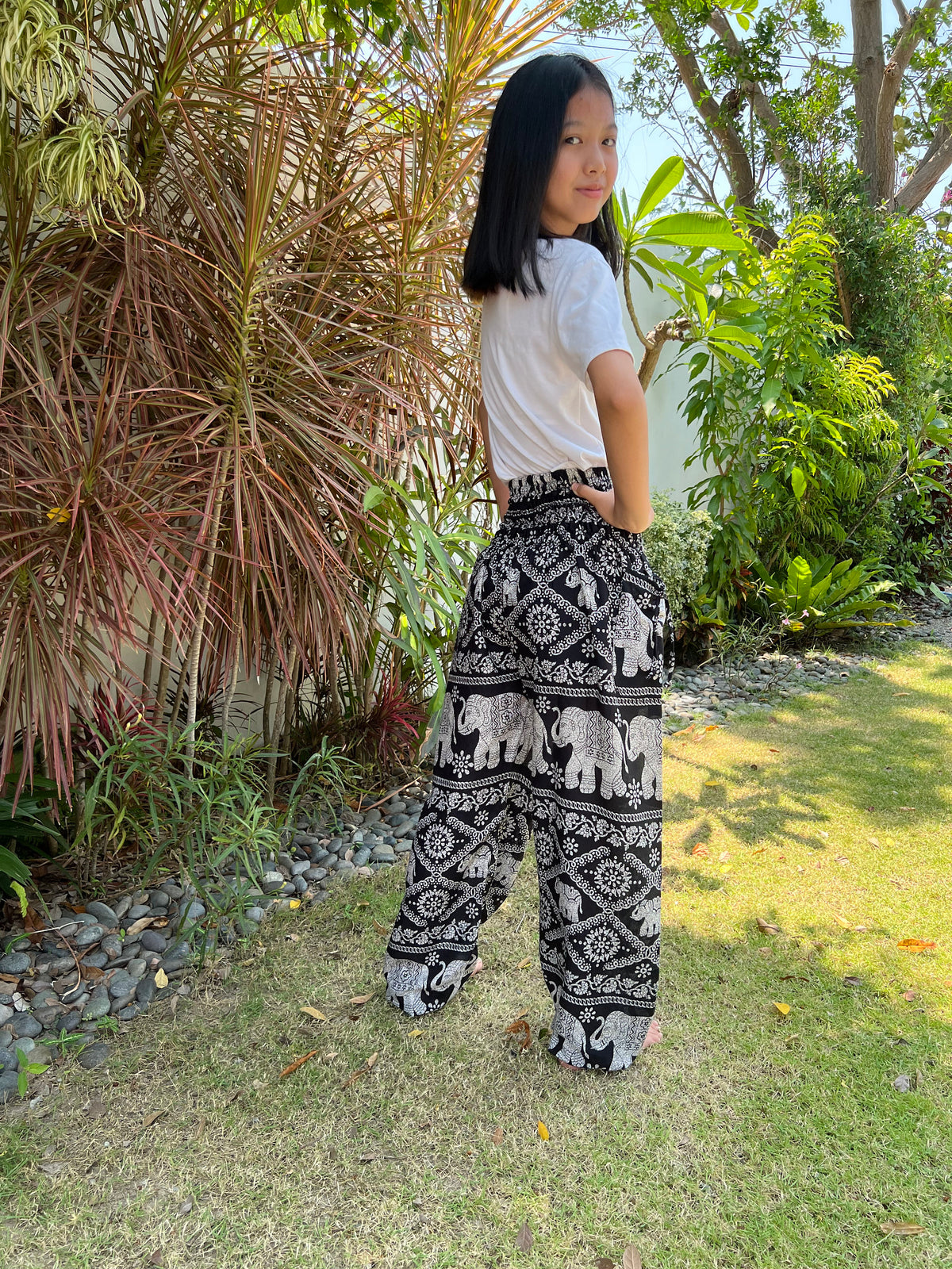 Unisex children boho pants with two pockets and decorative strings