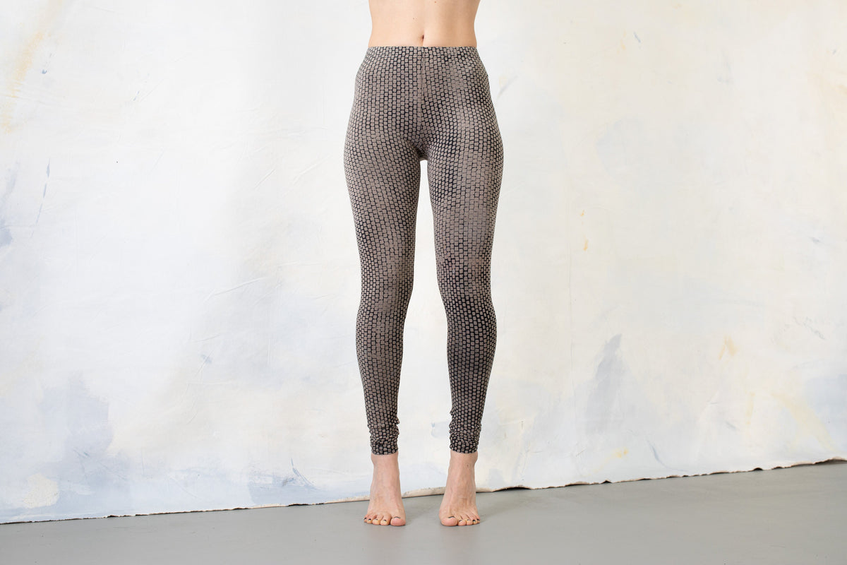 Unisex indigo beige leggings with stretchy fabric and abstract brick pattern