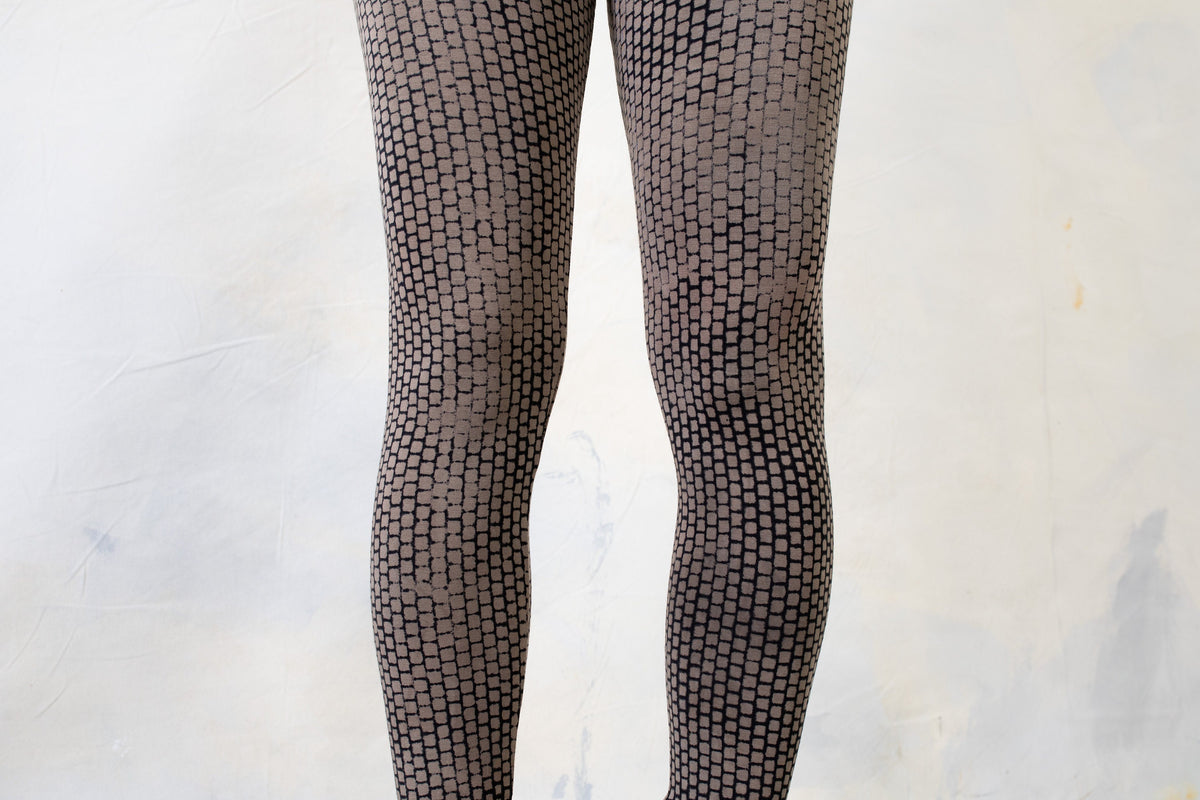 Soft stretchy leggings in indigo, beige, and blue abstract bricks design