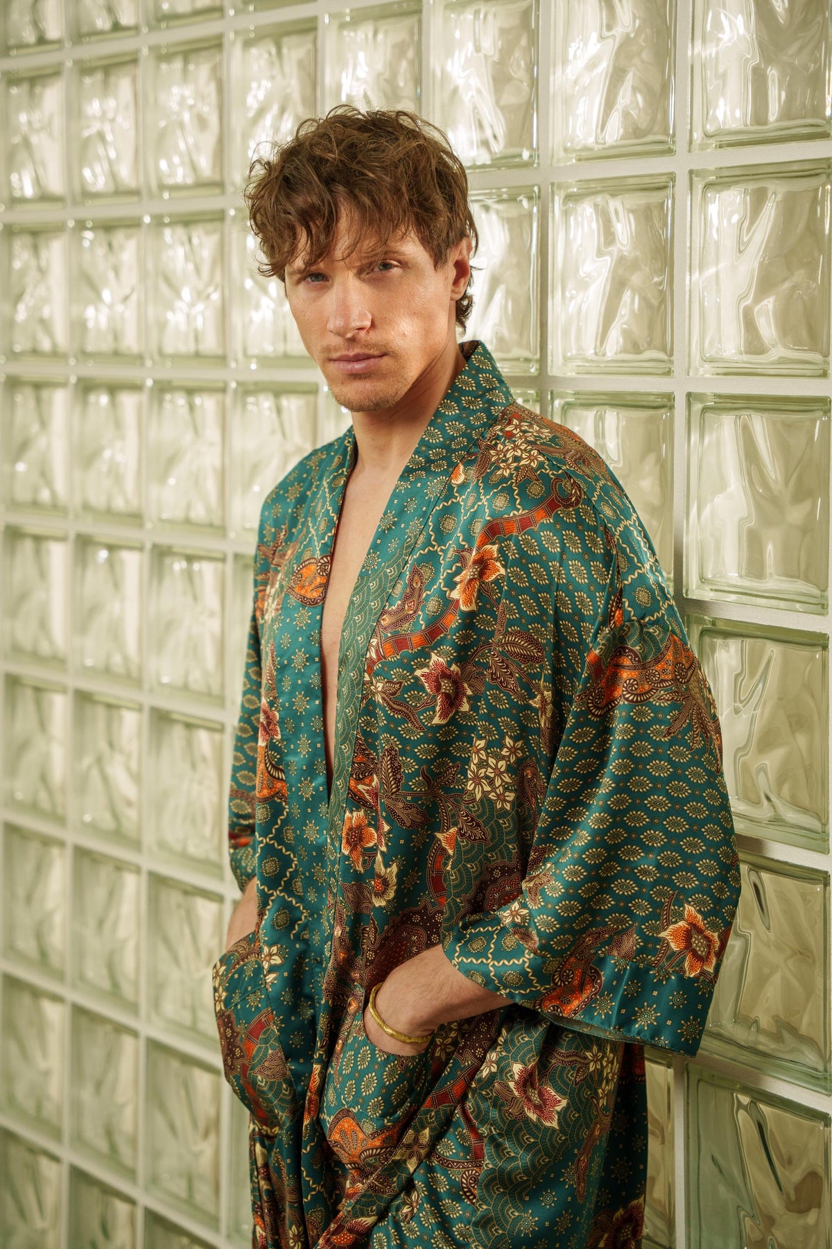 Emerald green men's satin kimono robe with bronze and gold batik-inspired detailing