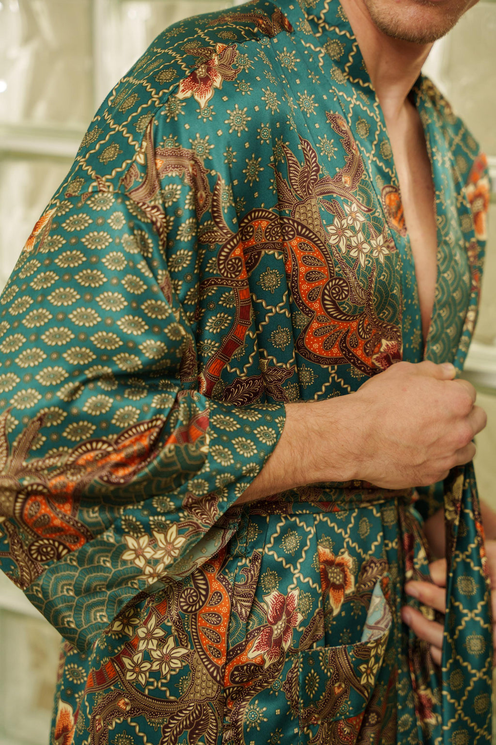 Men's emerald green dressing gown with long tailored silhouette and fluid drape