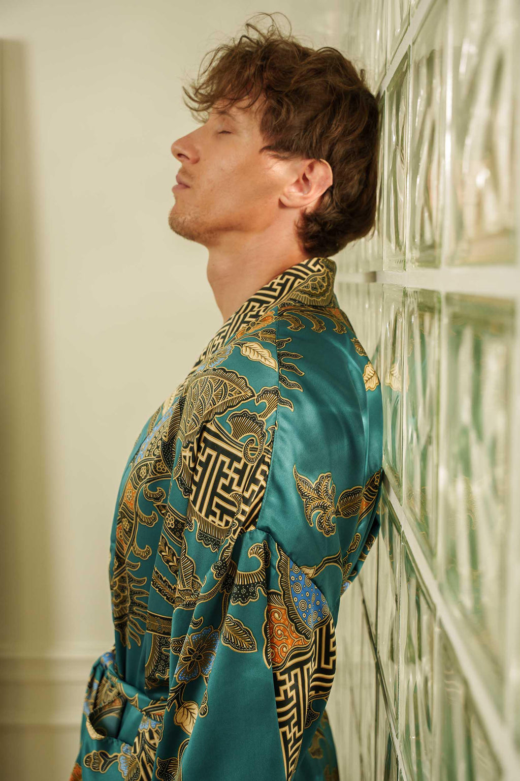 Men's long satin kimono robe in emerald green with batik-inspired detailing