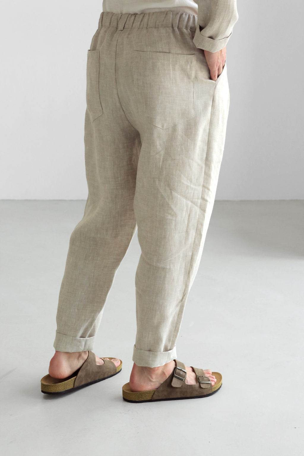 Beige linen joggers with elastic back waistband and pleated front