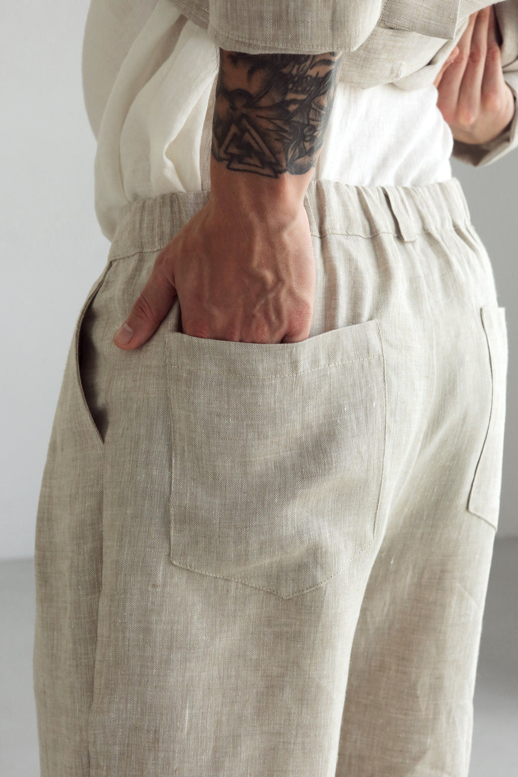 Men's loose fit linen pants in beige, perfect for outdoor and home