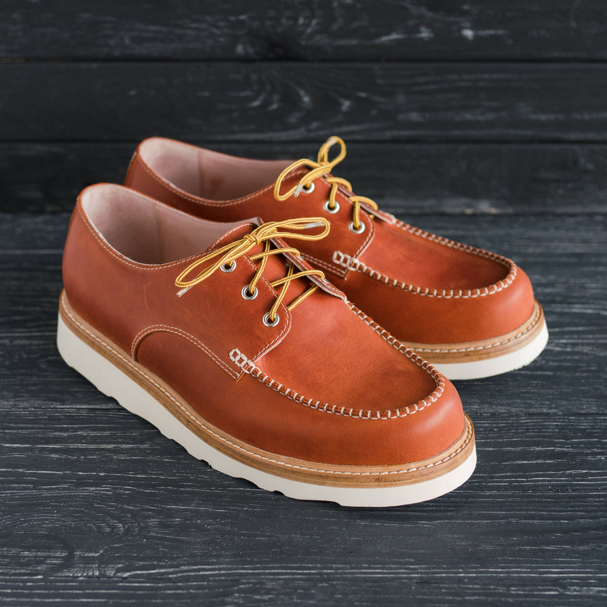 Men's moc toe orange oxford boots in waxed leather with white Vibram Cristy wedge sole