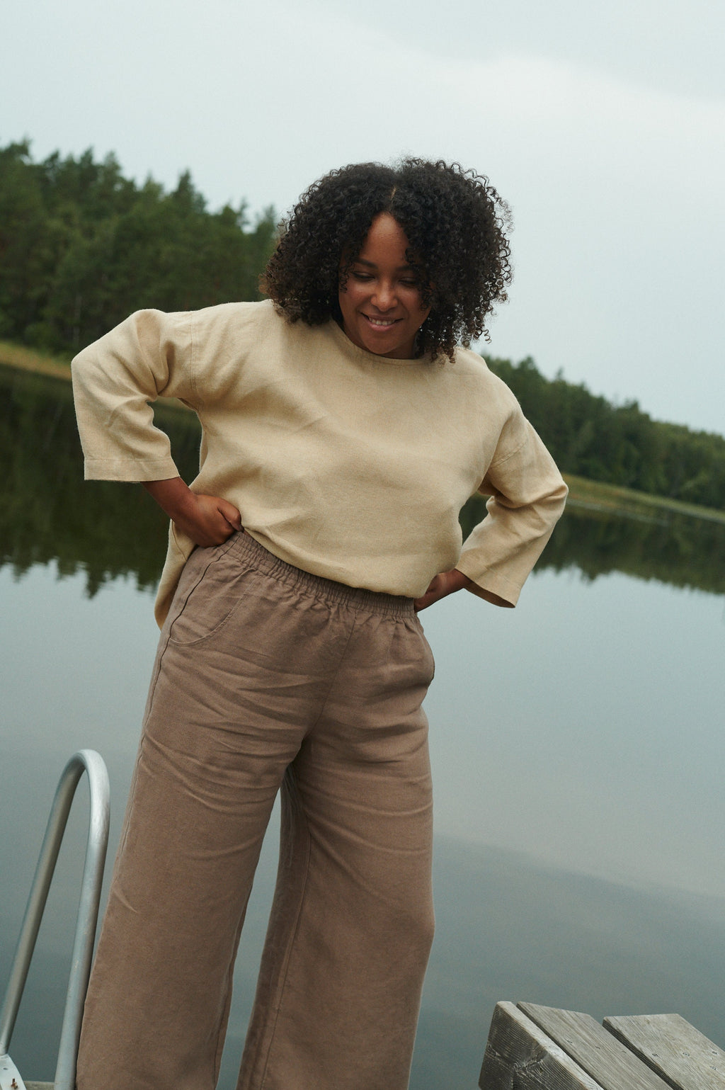 Cacao linen trousers styled for all-season wear, full length