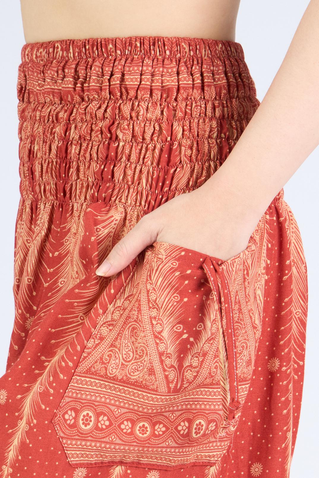 Orange boho harem pants with elastic ankles and comfortable fit