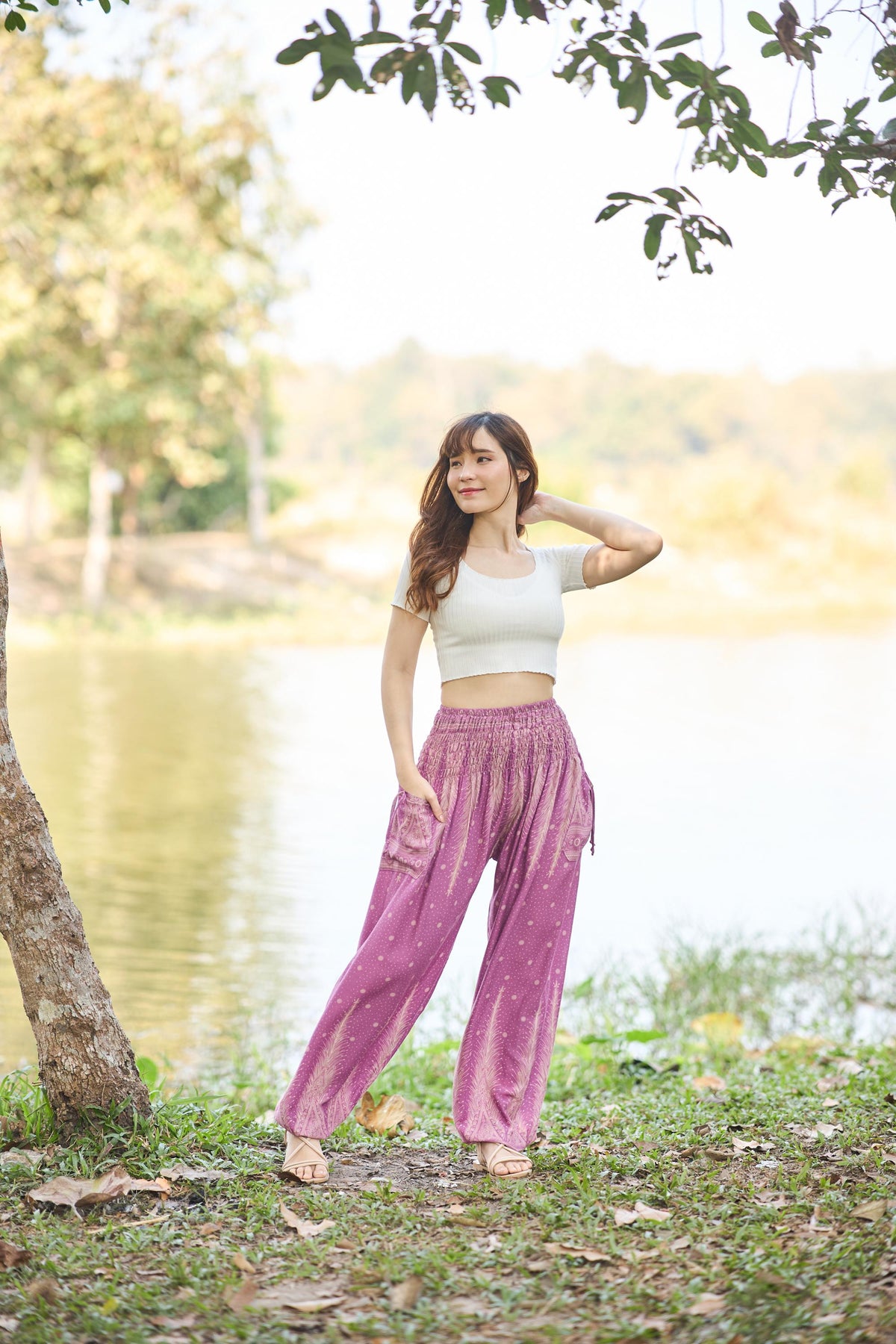 Pink peacock feather harem pants for women with smocked waist and side pockets