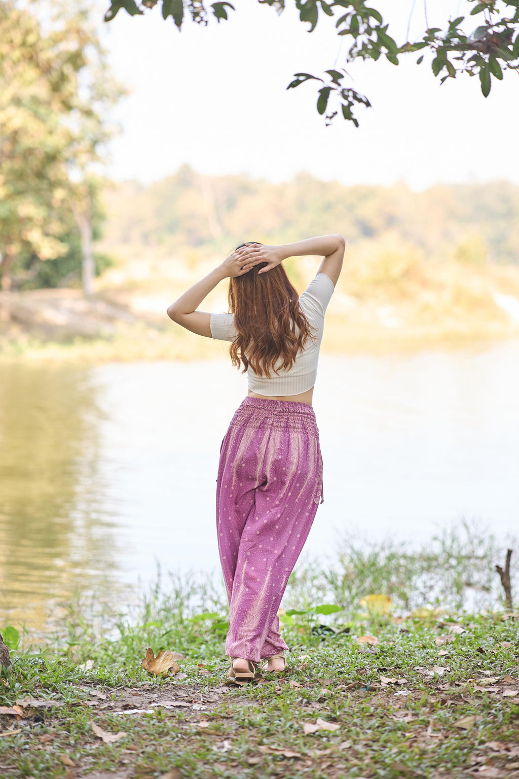 Lightweight pink harem pants with two pockets and smocked waistband