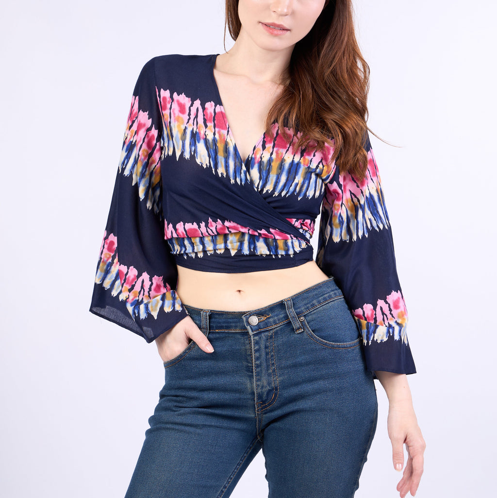 Handcrafted bohemian wrap top paired with jeans and denim shorts