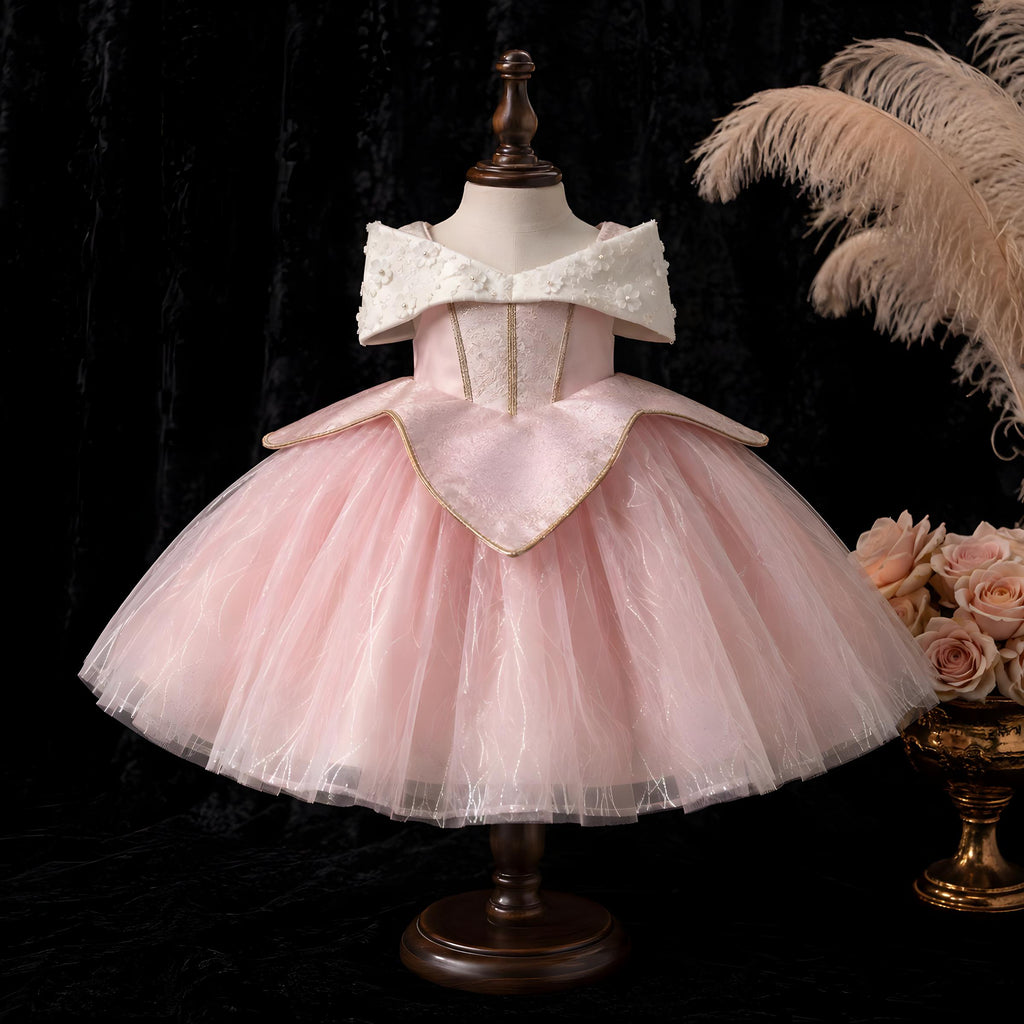 Gold-trimmed brocade bodice with pointed peplum on flower girl costume