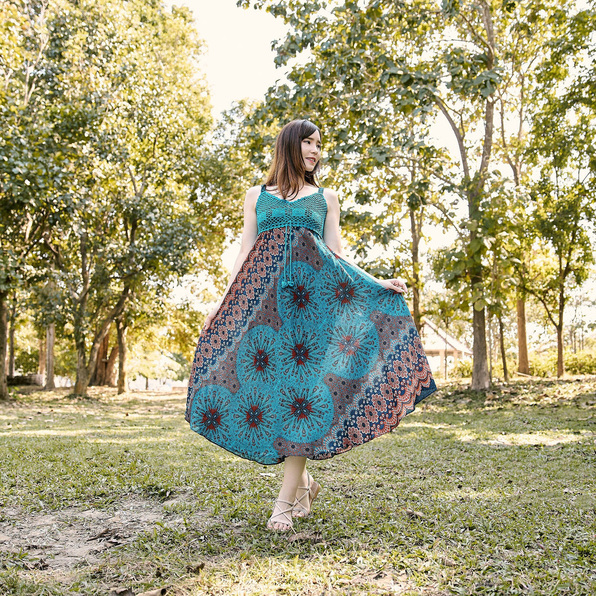 Teal crochet top dress with adjustable straps and smocked chest