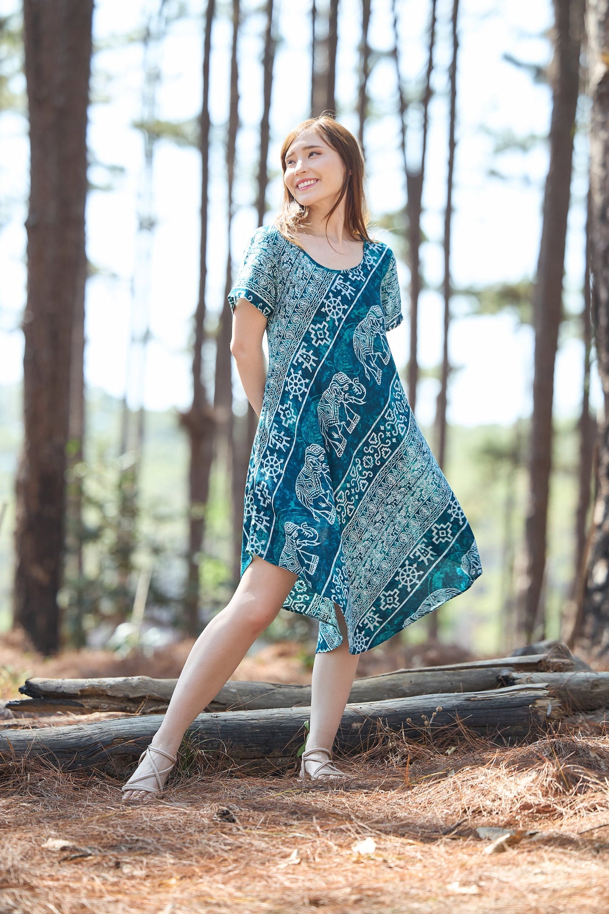 Teal elephant print rayon dress with short sleeves and two side pockets