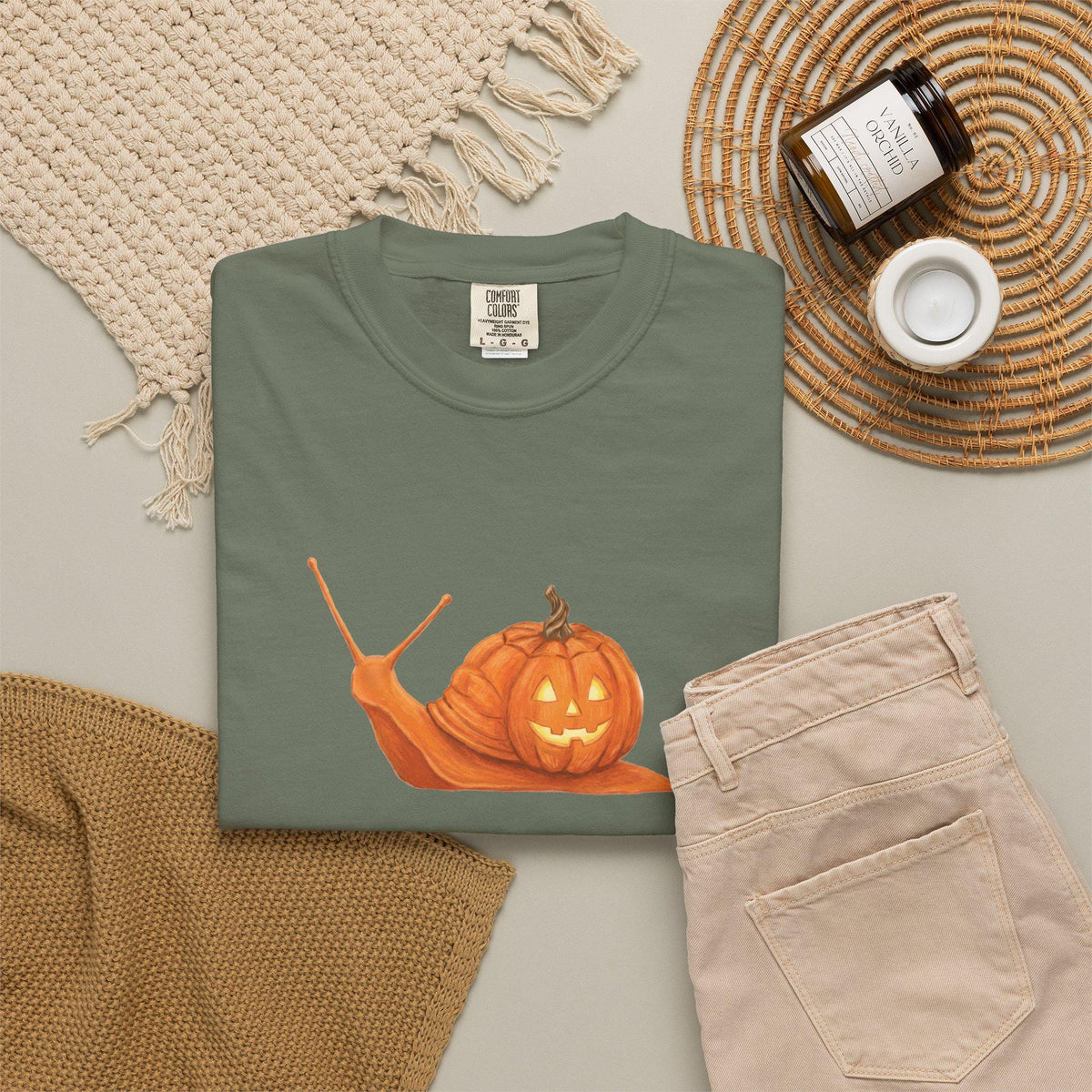 Whimsical fall tee featuring jack o' lantern and snail