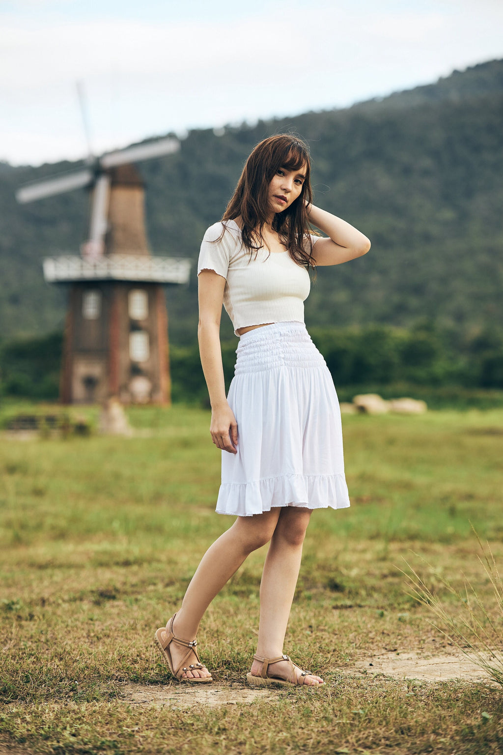 White flowy knee-length skater skirt for women with ruffle hem
