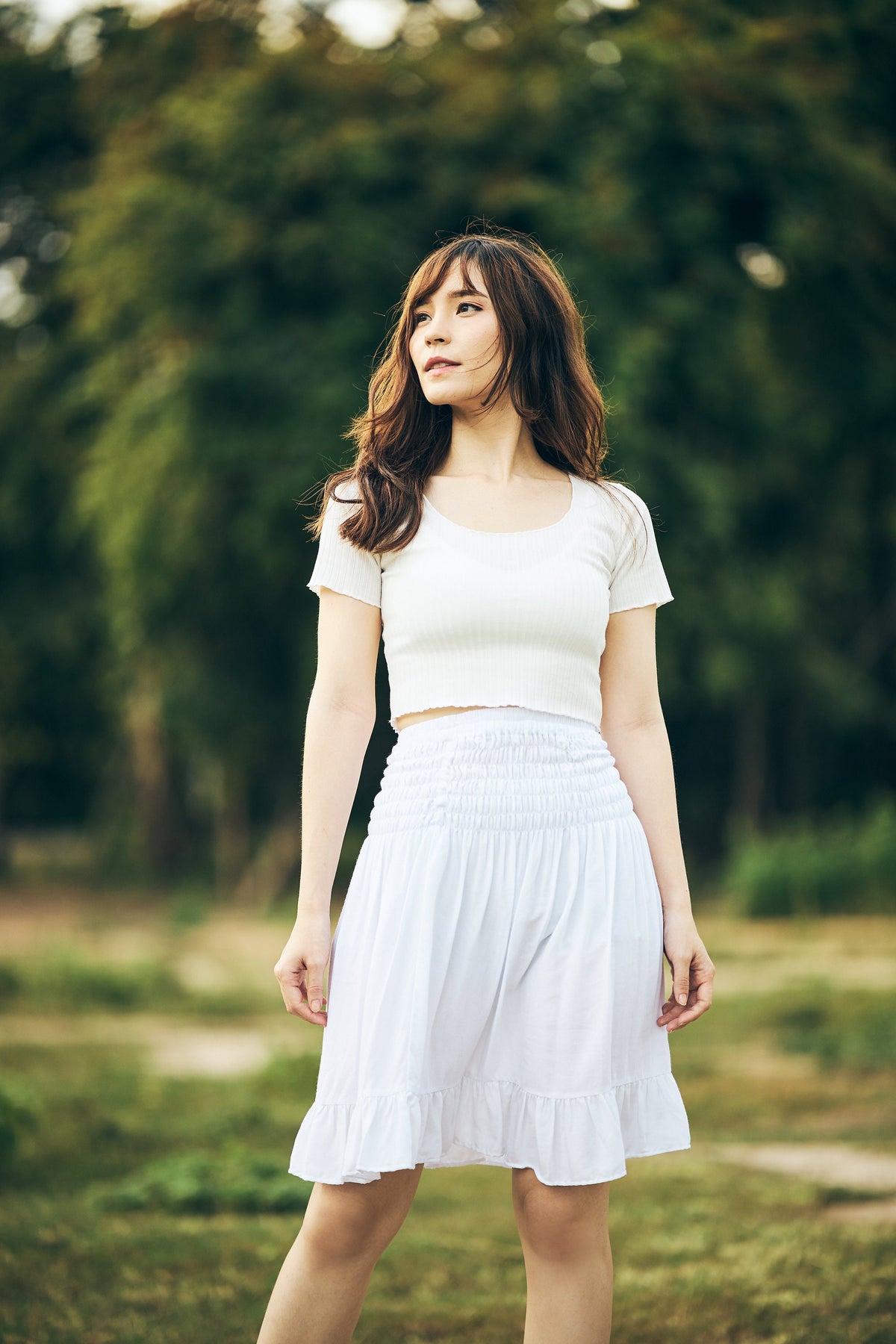 Women's white flowy mini skirt with ruffle detail
